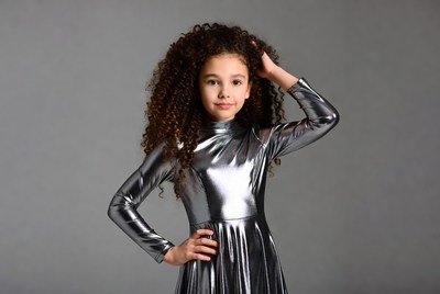 Girl in silver shiny dress posing