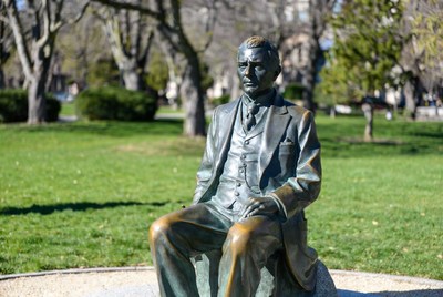 Bronze statue of man in suit