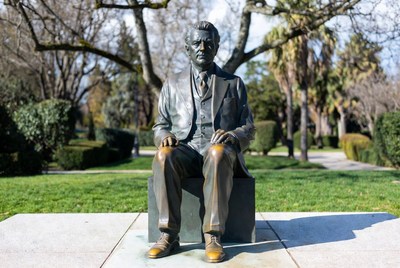 Bronze Statue of Seated Man in Park