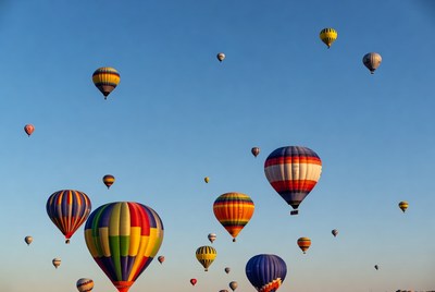 Colorful hot air balloons in blue sky