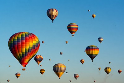 Colorful hot air balloons floating in sky