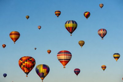 Colorful hot air balloons in blue sky