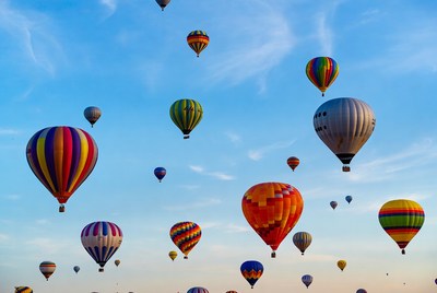 Colorful hot air balloons floating in sky