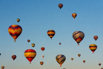 Colorful hot air balloons in blue sky