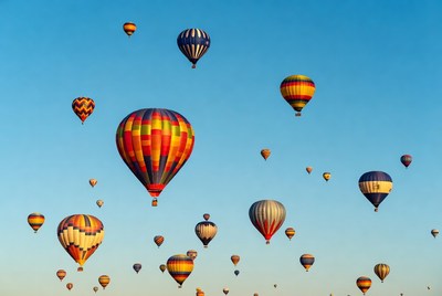 Colorful hot air balloons floating in sky