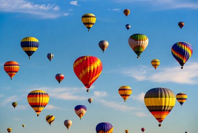 Colorful hot air balloons in blue sky