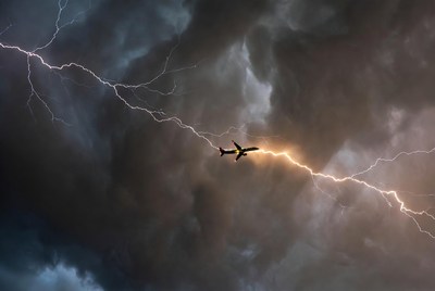 Airplane Flying Through Lightning Storm