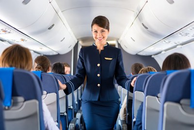 Flight Attendant Serving Airplane Passengers