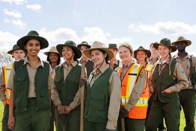 Group of diverse rangers with shovels