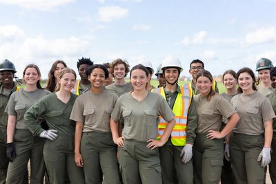 Diverse construction workers group smiling outdoors