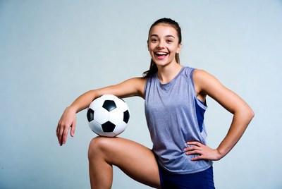 Girl holding soccer ball