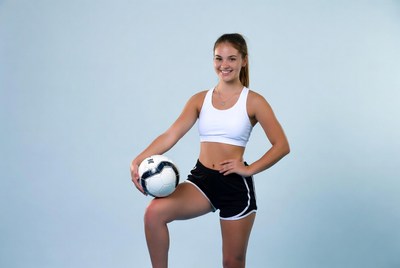 Girl holding soccer ball