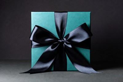 Teal gift box with black bow