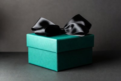 Teal gift box with black bow