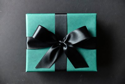 Teal gift box with black bow