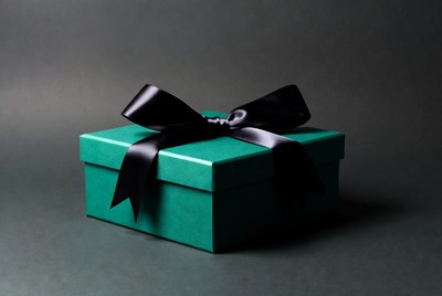 Green gift box with black bow