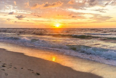 Sunset over ocean beach