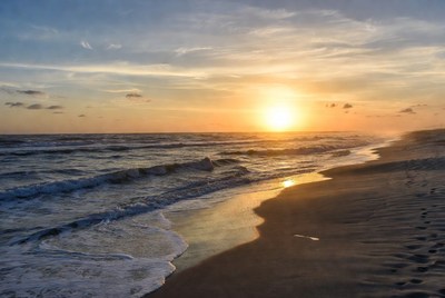 Sunset over ocean beach