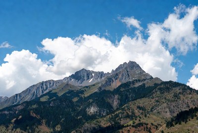 Majestic Snow-Capped Mountains Under Blue Sky