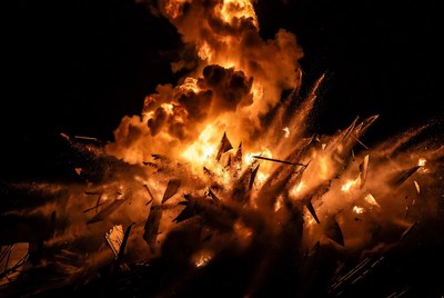 Massive fiery explosion with debris