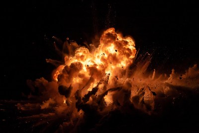 Massive Orange Explosion on Black Background