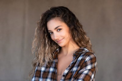 Smiling woman in plaid shirt