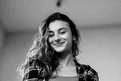 Smiling young woman with wavy hair