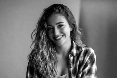 Smiling woman with wavy hair