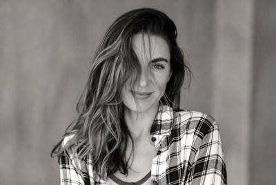 Smiling woman with wavy hair