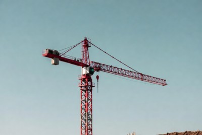 Red Tower Crane on Blue Sky