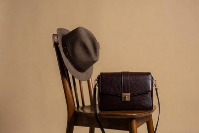 Brown Fedora Hat and Leather Bag on Chair