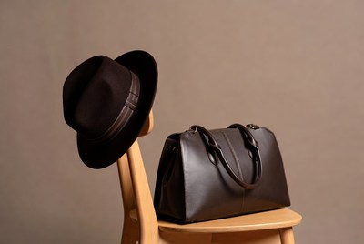 Fedora Hat and Leather Handbag on Chair