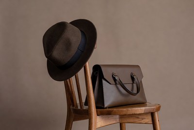 Brown Fedora Hat and Leather Handbag on Chair