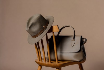 Gray Fedora Hat and Handbag on Chair