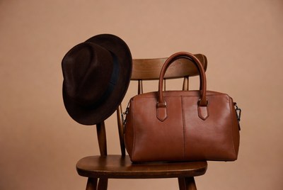 Brown Fedora Hat and Leather Handbag on Chair
