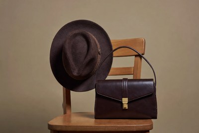 Brown Fedora Hat and Leather Handbag on Chair