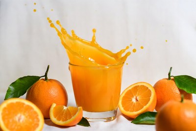Orange Juice Splashing from Glass