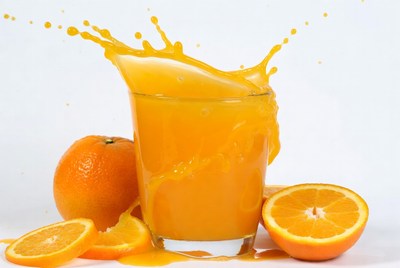 Orange Juice Splashing from Glass