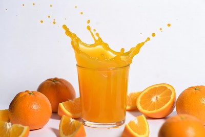 Orange Juice Splashing from Glass