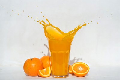 Orange Juice Splashing from Glass