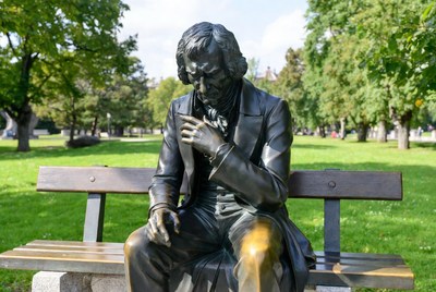 Bronze Statue of Man on Park Bench