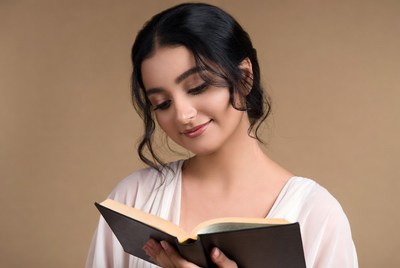 Young woman reading book