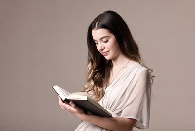 Young woman reading book