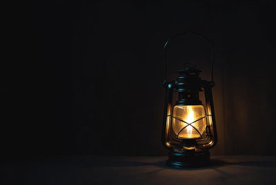 Vintage Lantern Glowing on Dark Background