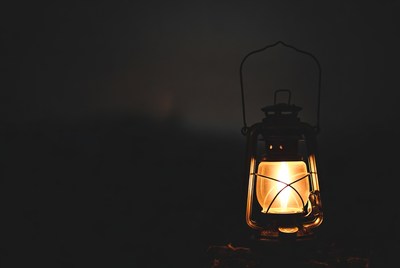 Vintage Lantern Glowing in Darkness