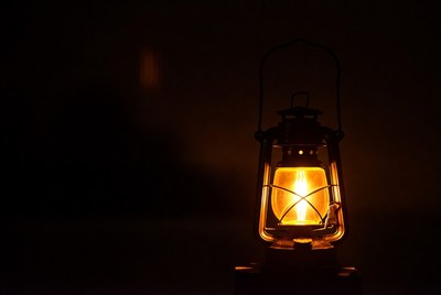 Vintage Lantern Glowing on Dark Background