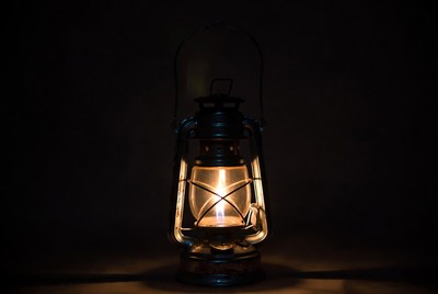Vintage Lantern Glowing on Black Background