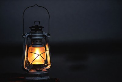 Vintage Lantern Glowing on Dark Background