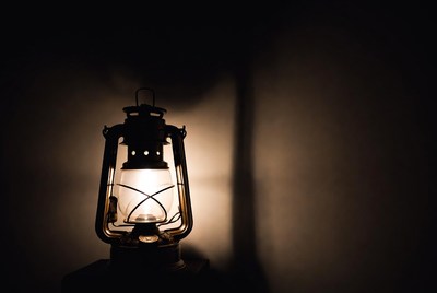 Vintage Lantern Glowing on Dark Background