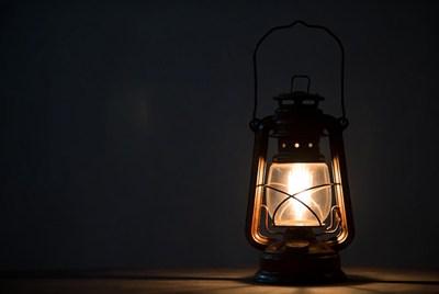 Vintage Lantern Glowing on Dark Background